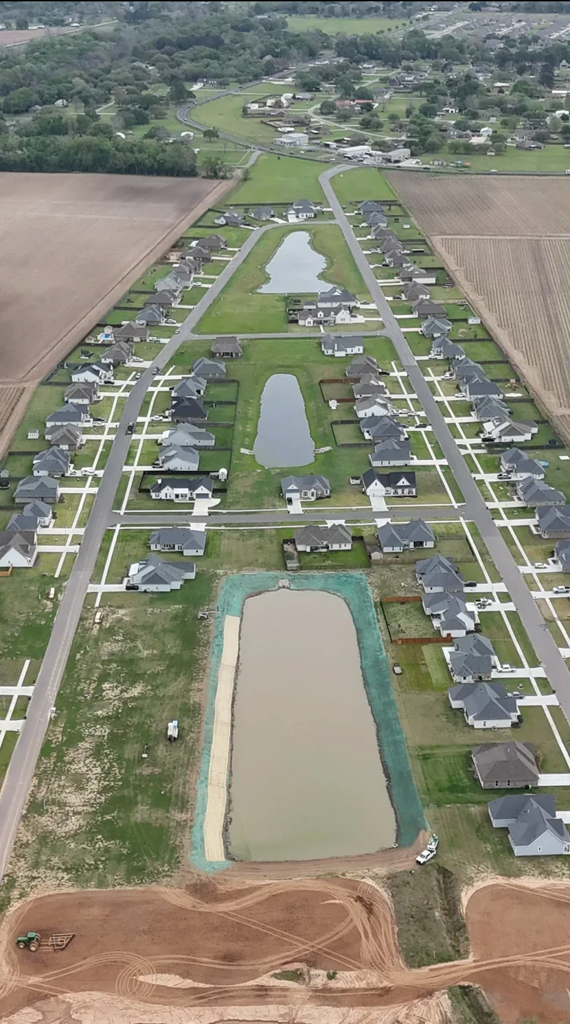 Aerial view of a South Louisiana residential development and stabilized pond