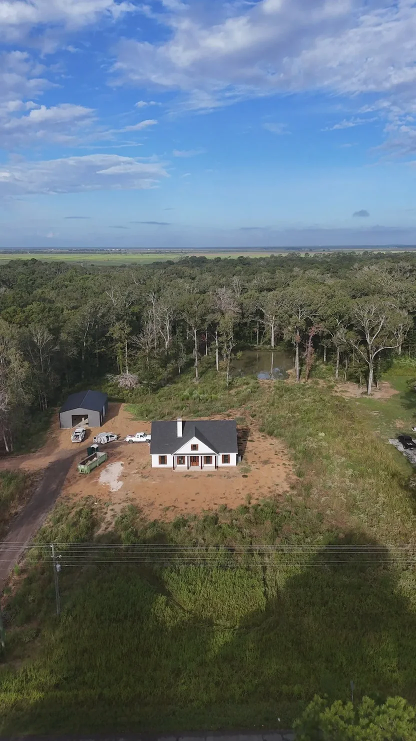 Aerial view of a residential site and surrounding land