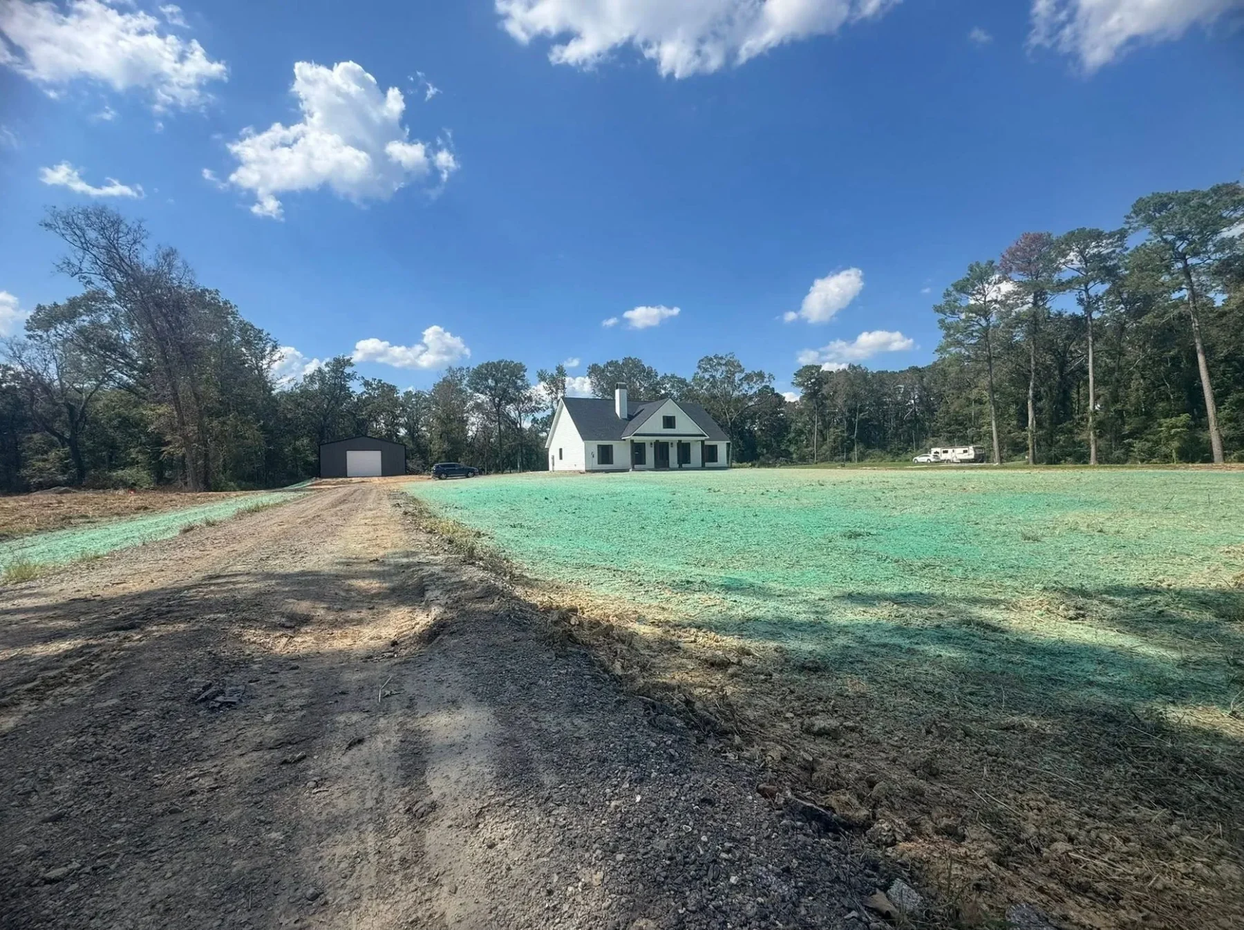 Hydroseeding applied across a residential property